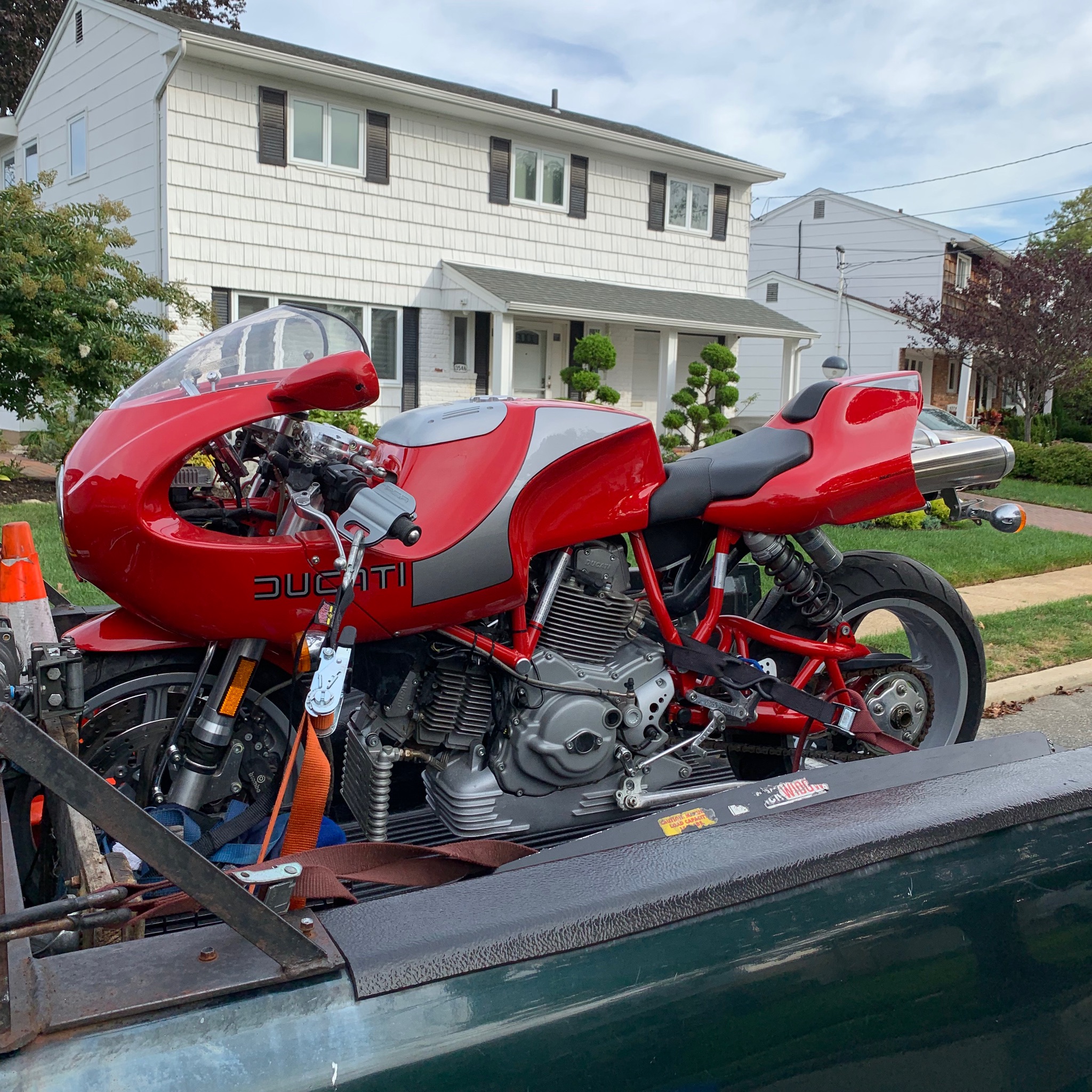 Red sport motorcycle secured on the transport deck