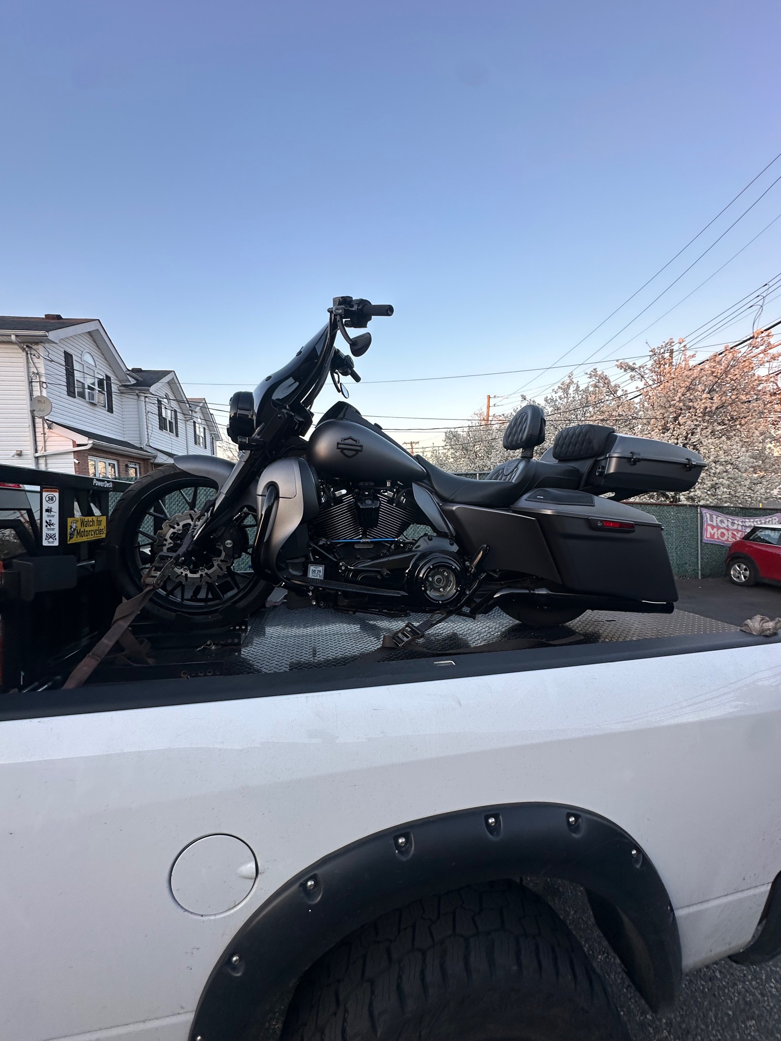 Black touring motorcycle loaded on the MAD Transpo NYC pickup