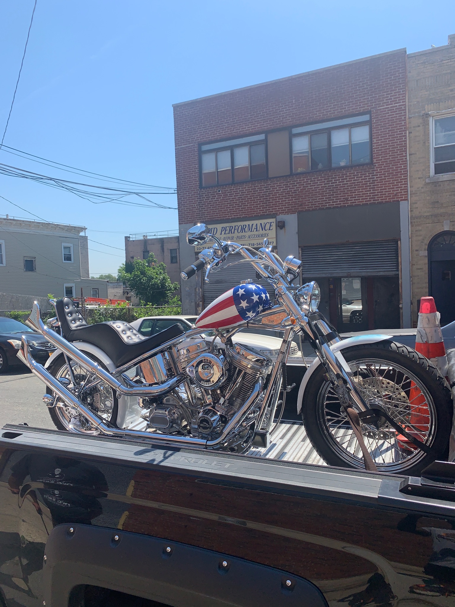 Custom cruiser motorcycle secured on the transport deck