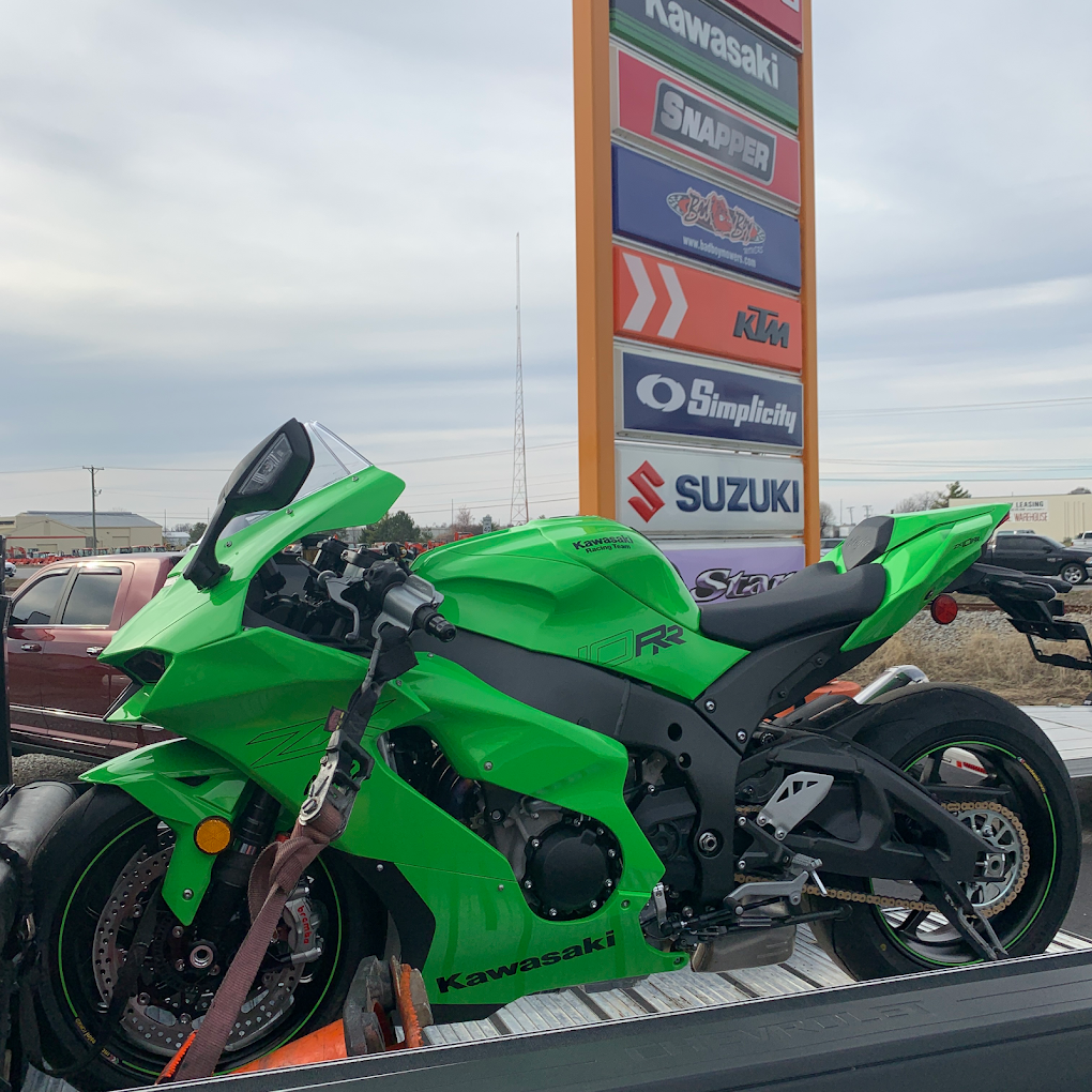 Green Kawasaki sport motorcycle prepared for transport