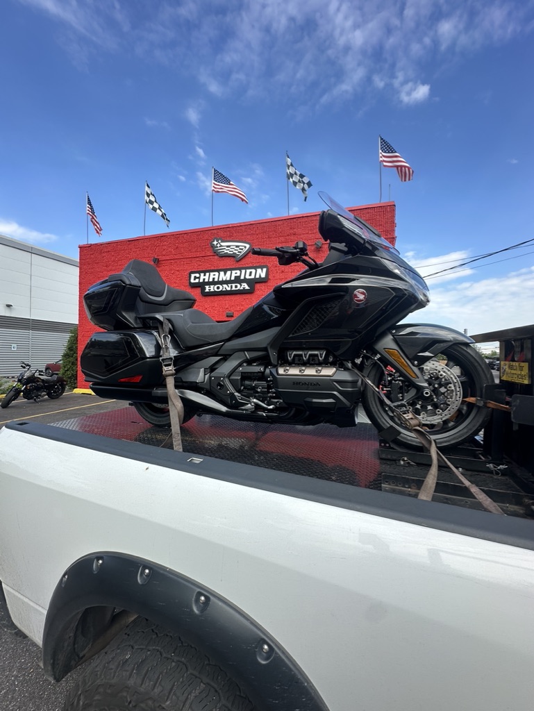 Black sport motorcycle secured on the MAD Transpo NYC pickup