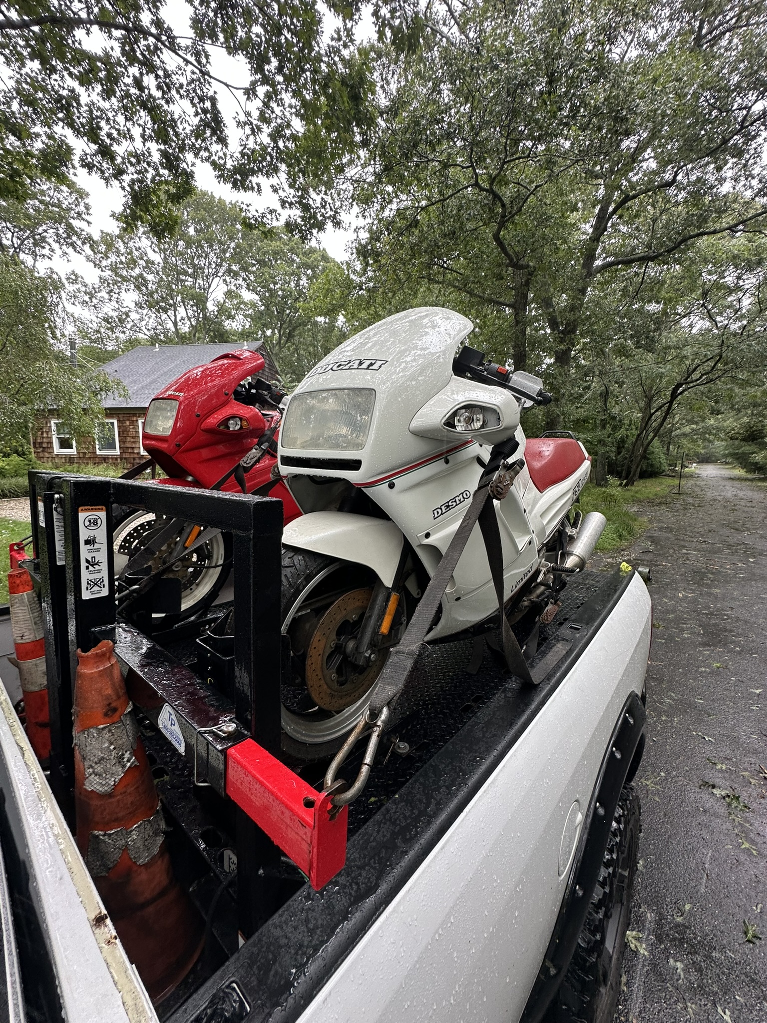 Vintage white sport motorcycle secured on the transport deck